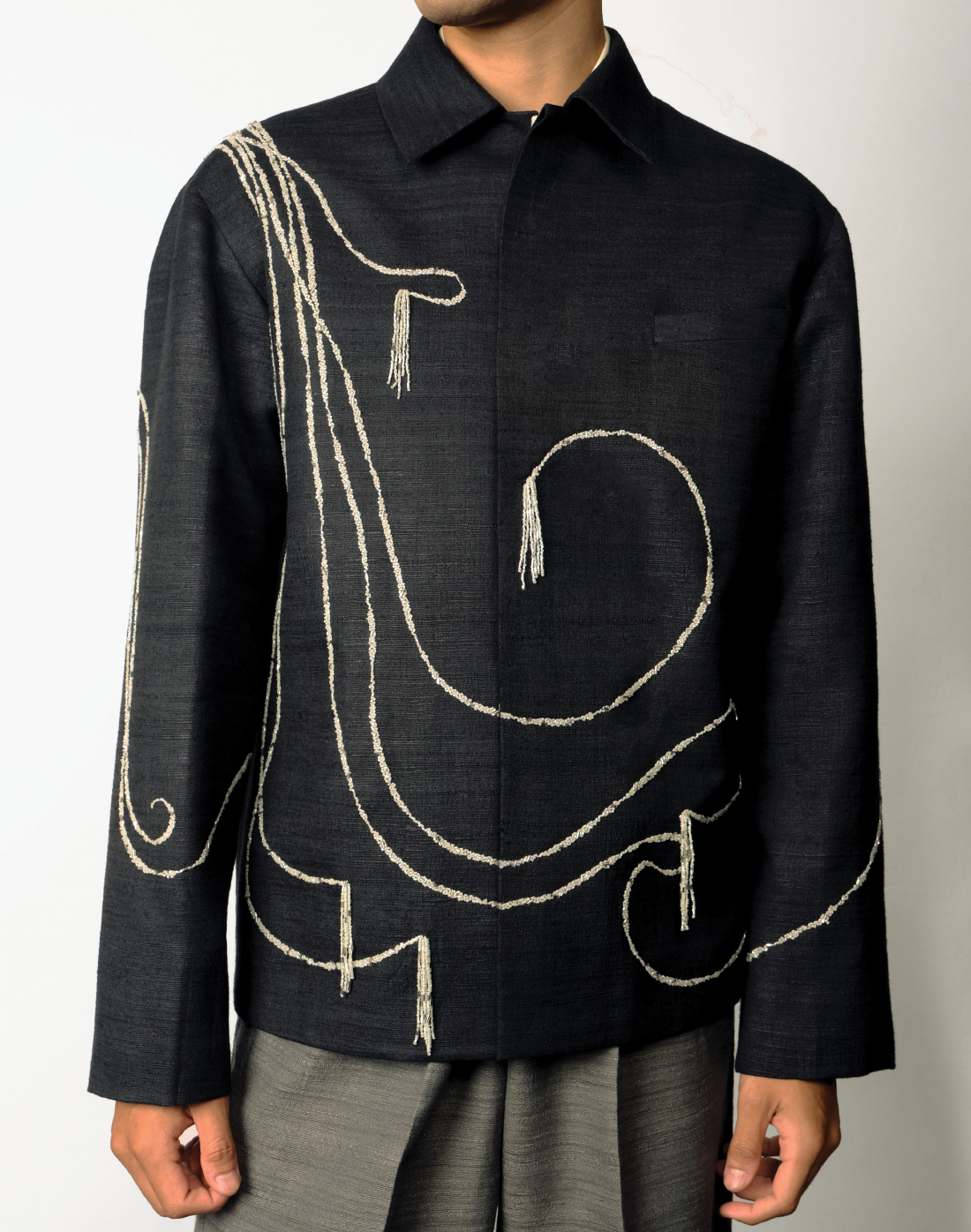 black Handloom khadi silk jacket with pale green tasselled beadwork - boxy fit, concealed front, crafted in India front
