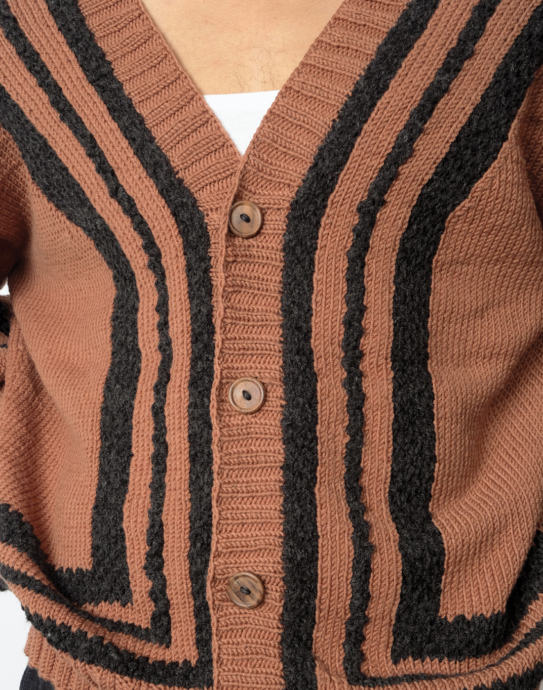 brown hand-knit wool cardigan with oversized fit, V-neck, and chunky grey knit outlines by Taarini Anand close up