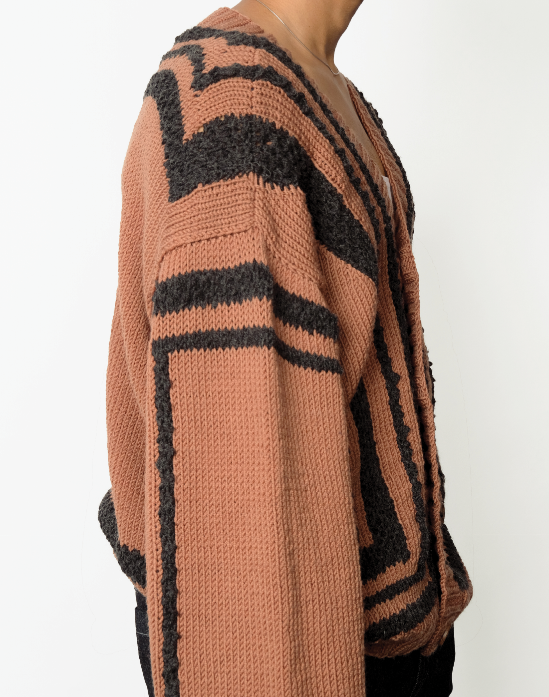 brown hand-knit wool cardigan with oversized fit, V-neck, and chunky grey knit outlines by Taarini Anand side