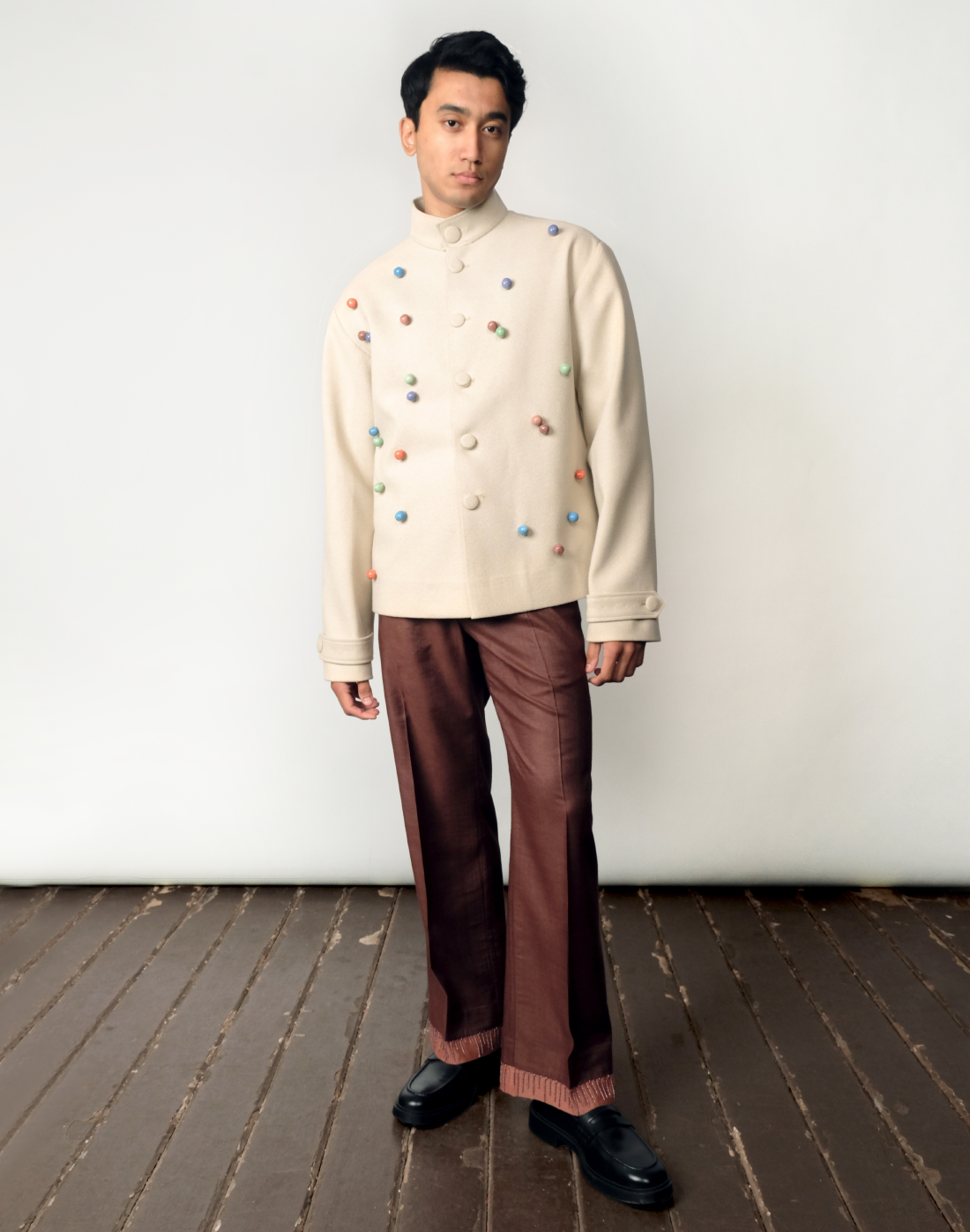 Artisanal wool twill jacket in beige with colourful handmade ceramic beads by Taarini Anand