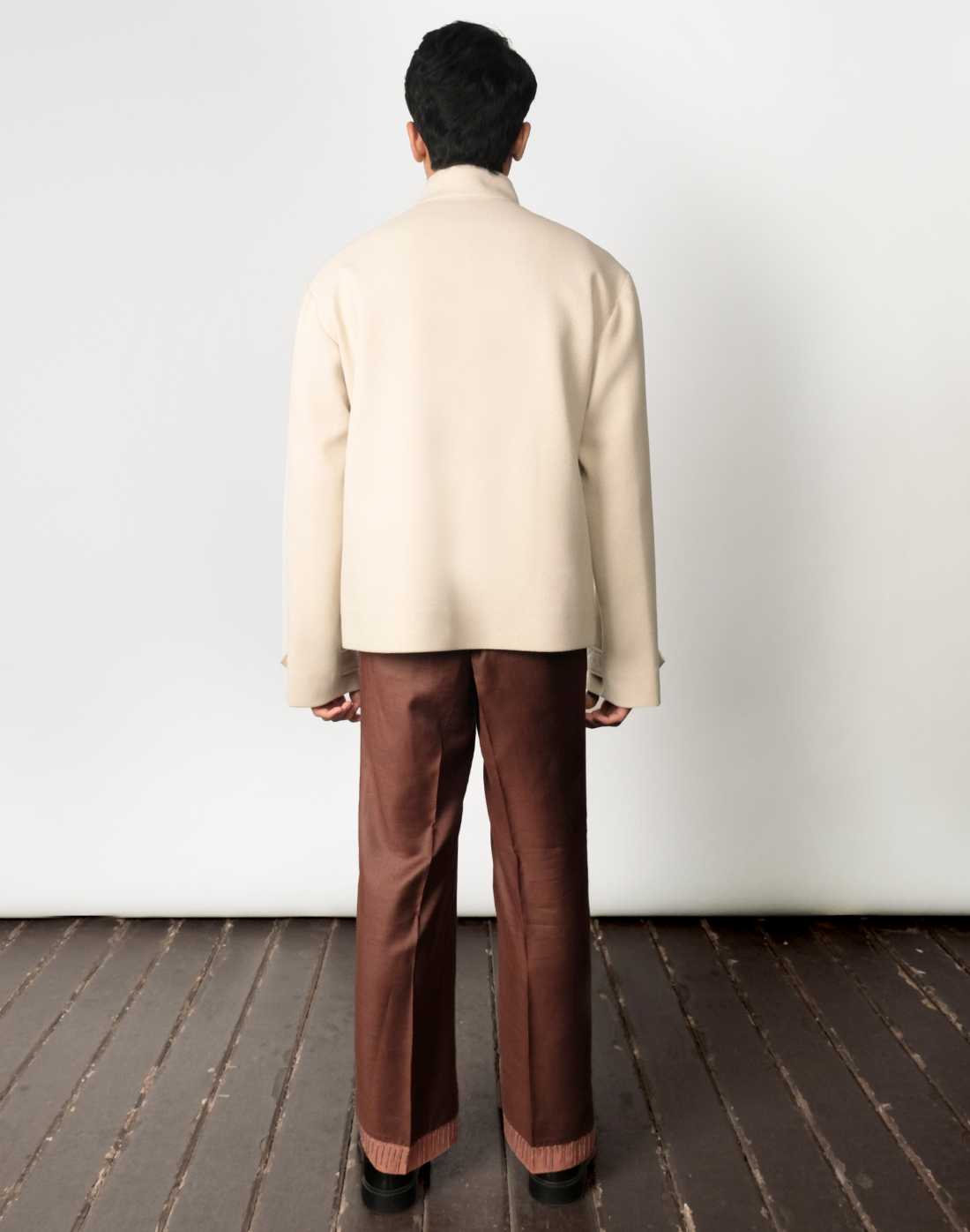 Artisanal wool twill jacket in beige with colourful handmade ceramic beads by Taarini Anand back