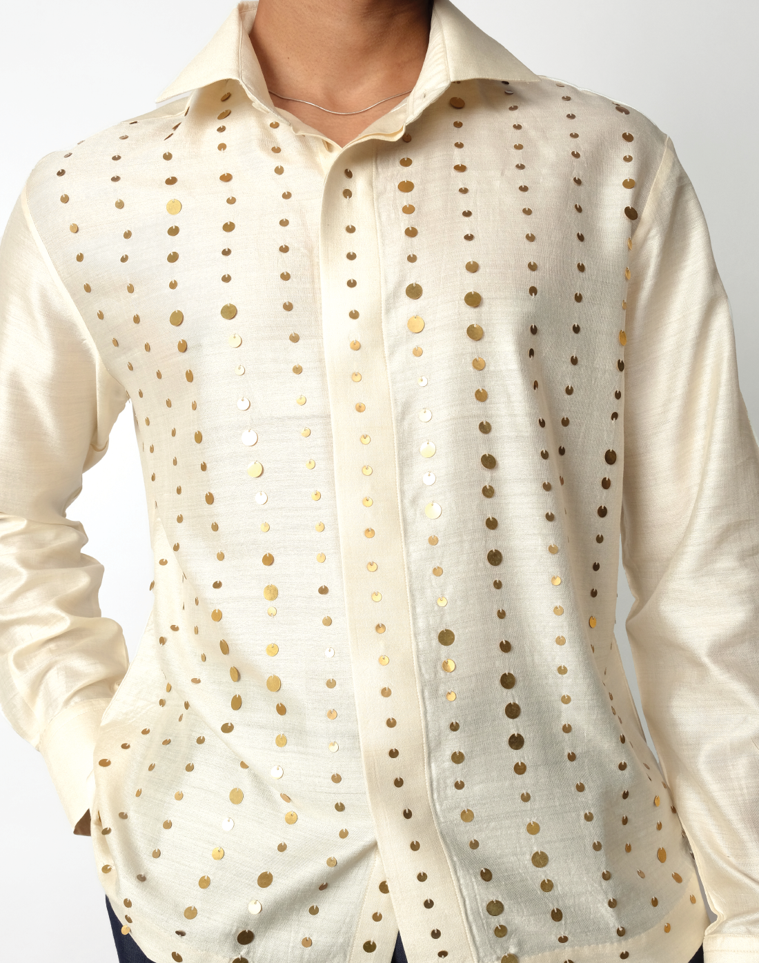 Relaxed fit cream handloom silk shirt with gold sequin stripes and concealed, crafted in India by Taarini Anand for men close up