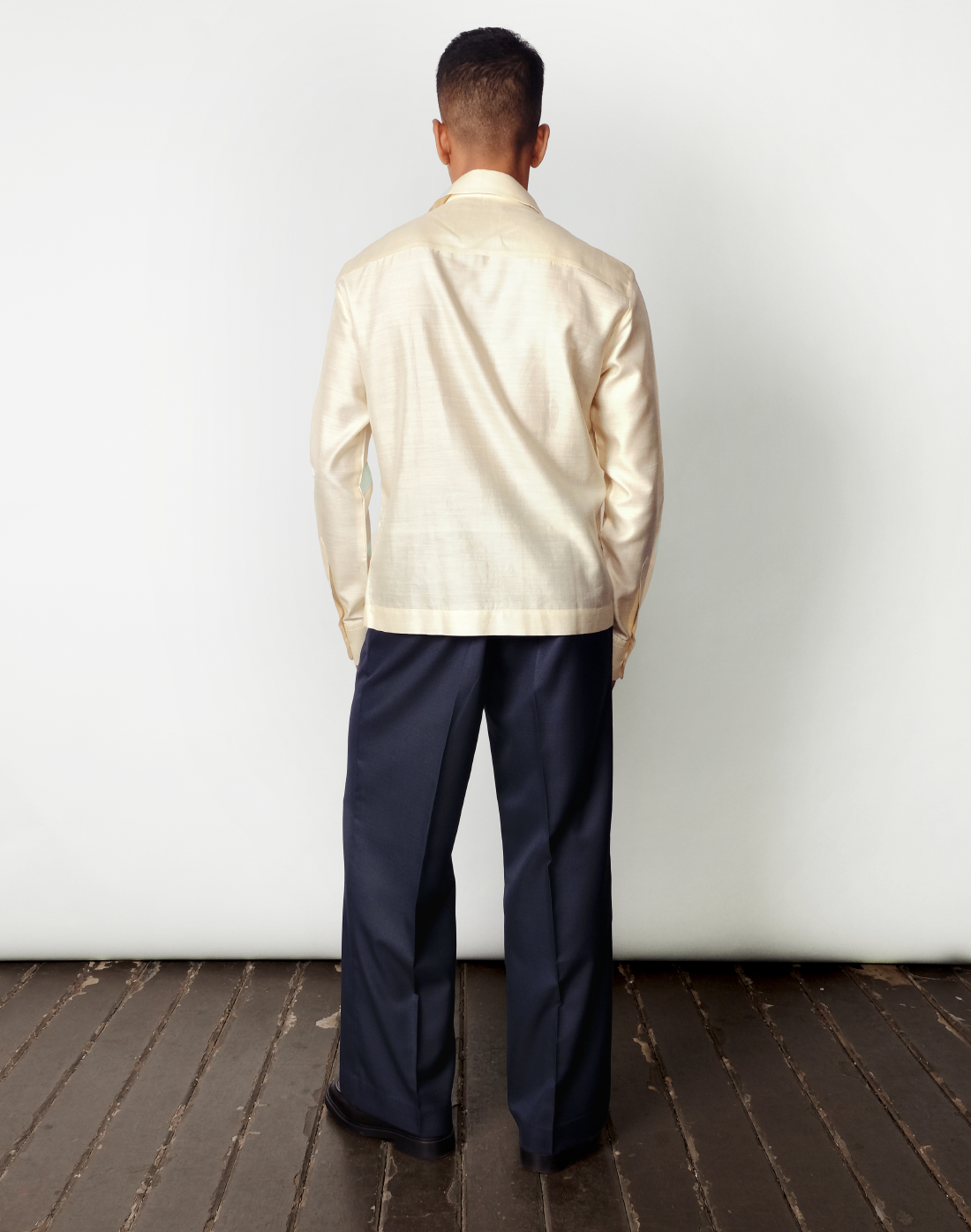 Relaxed fit cream handloom silk shirt with gold sequin stripes and concealed, crafted in India by Taarini Anand for men