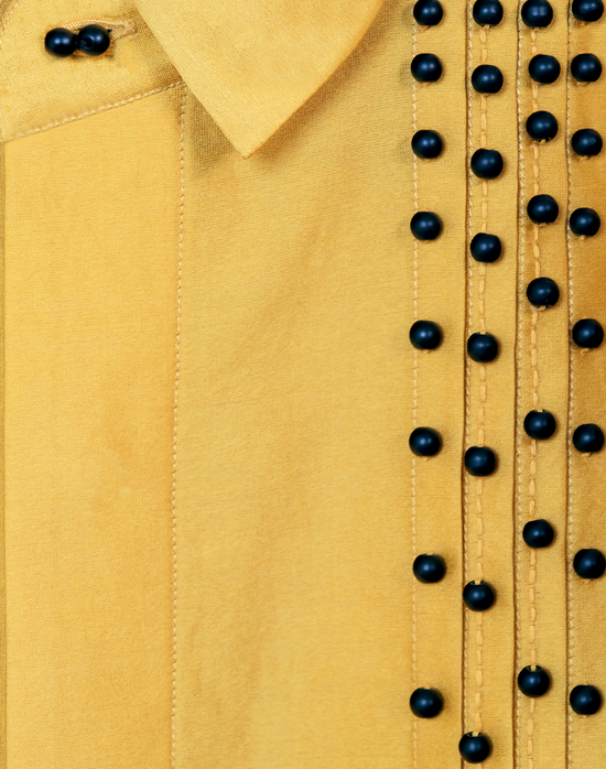 Taarini Anand Dilli Silk Shirt in mustard handloom silk with pintucks, kantha stitches and black glass bead embroidery close up