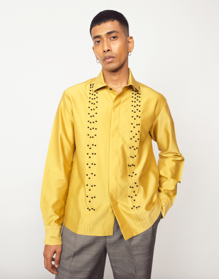 Taarini Anand Dilli Silk Shirt in mustard silk with pintucks, kantha stitches and black glass bead embroidery
