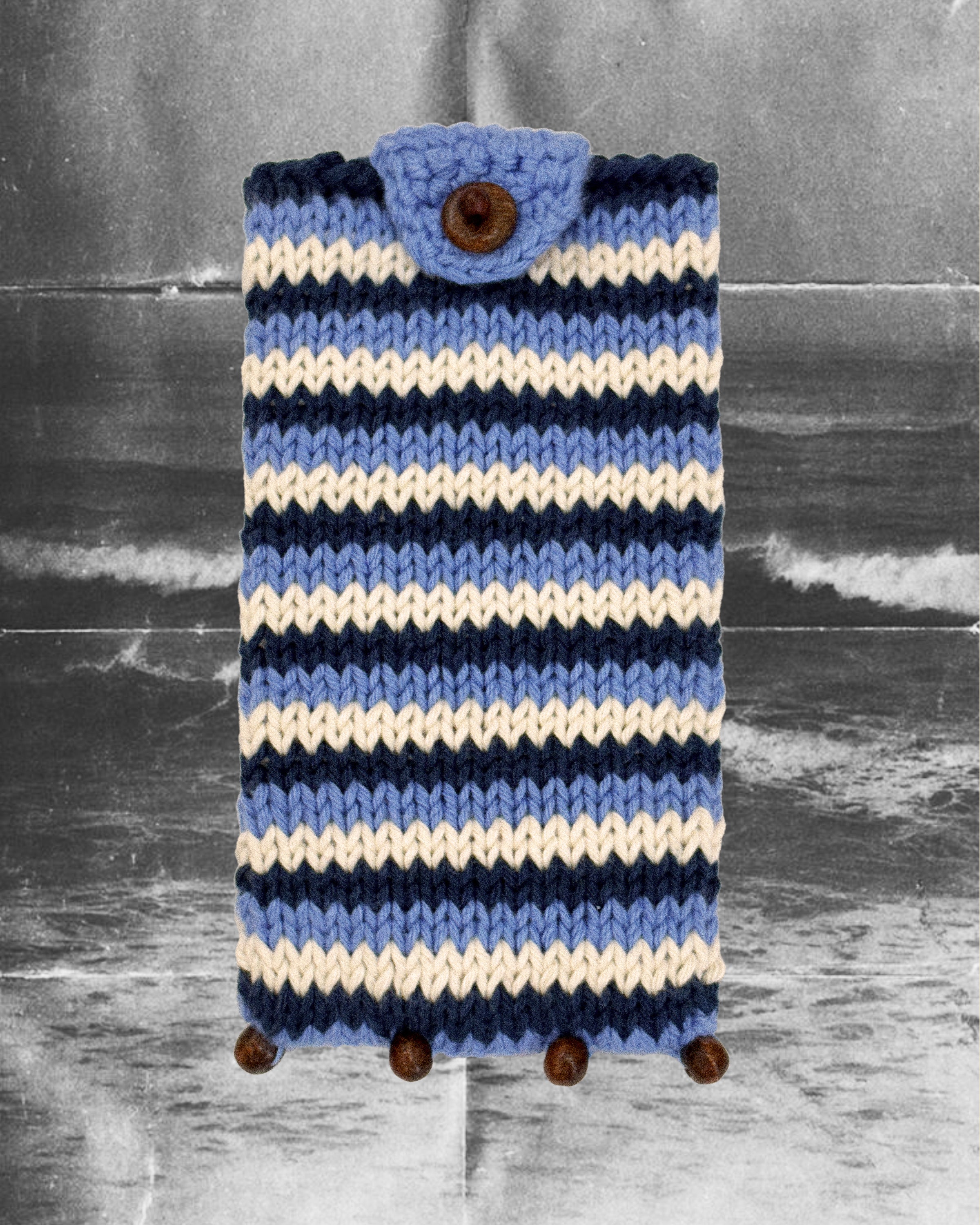 Hand-knitted blue Eye Candy Pouch in cotton with wooden beads by Taarini Anand