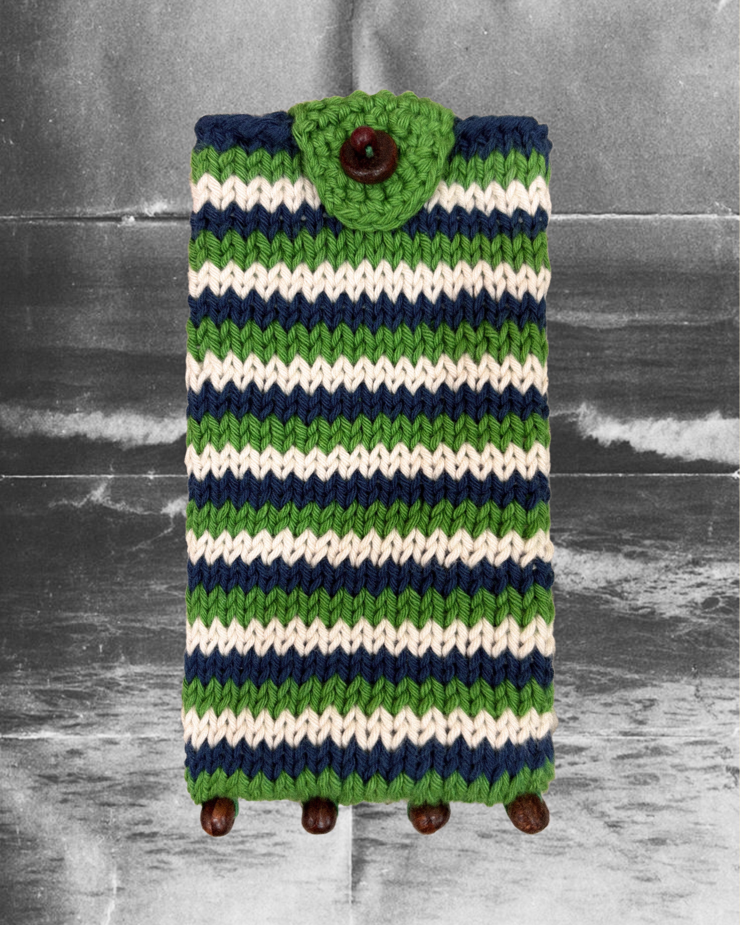 Hand-knitted green Eye Candy Pouch in cotton with wooden beads by Taarini Anand