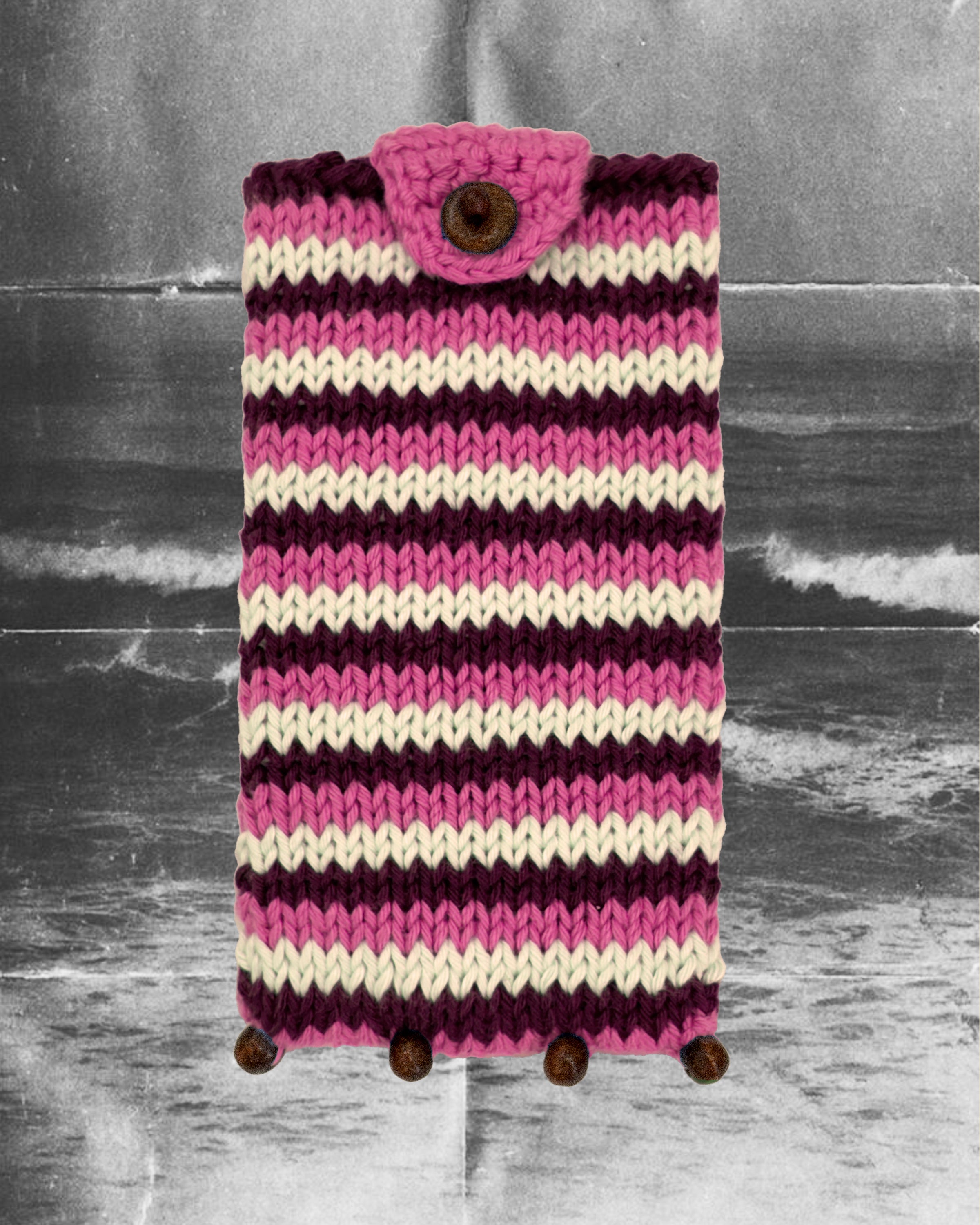 Hand-knitted pink Eye Candy Pouch in cotton with wooden beads by Taarini Anand