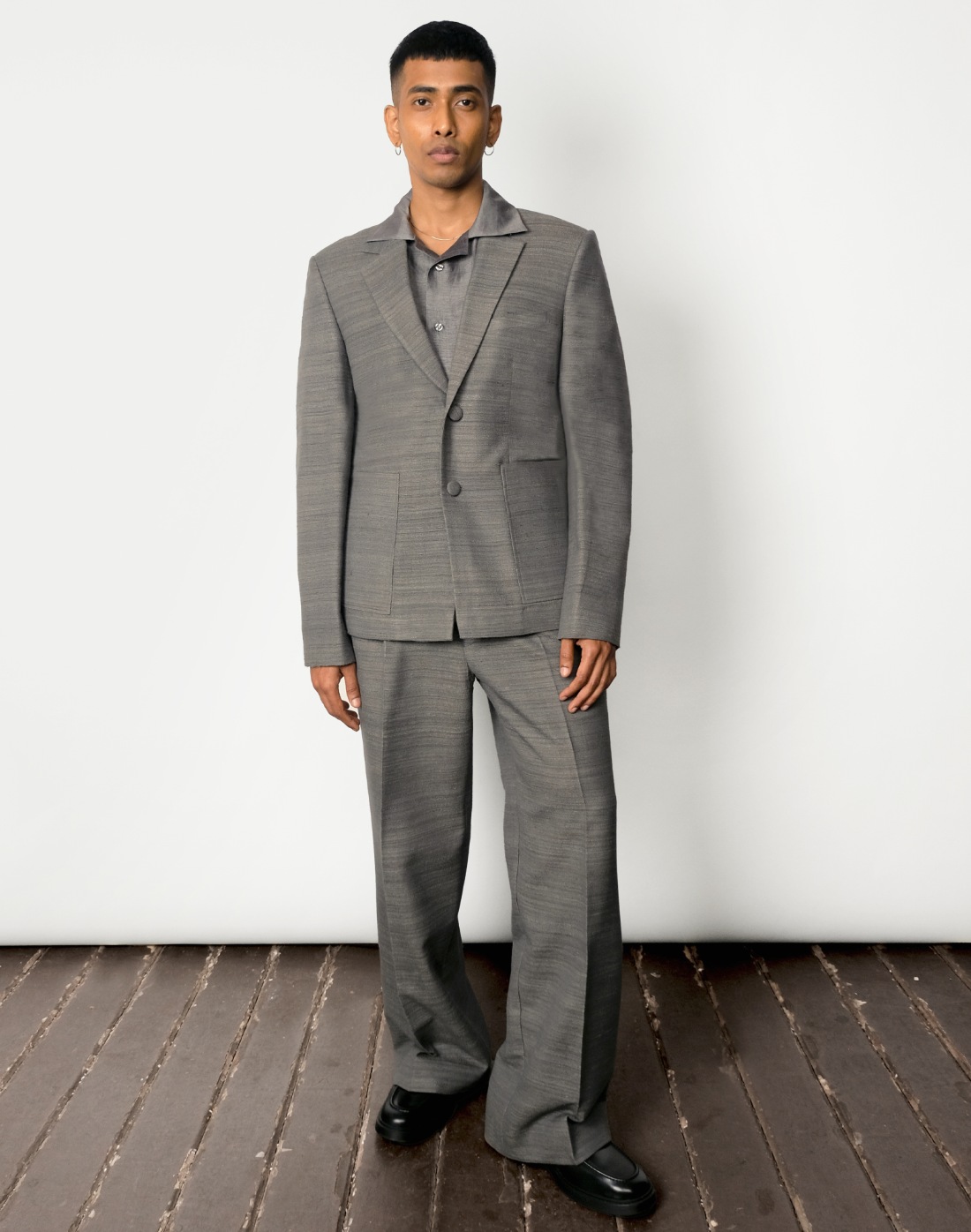 Grey handloom matka silk single-breasted blazer with notch lapels and patch pockets by Taarini Anand