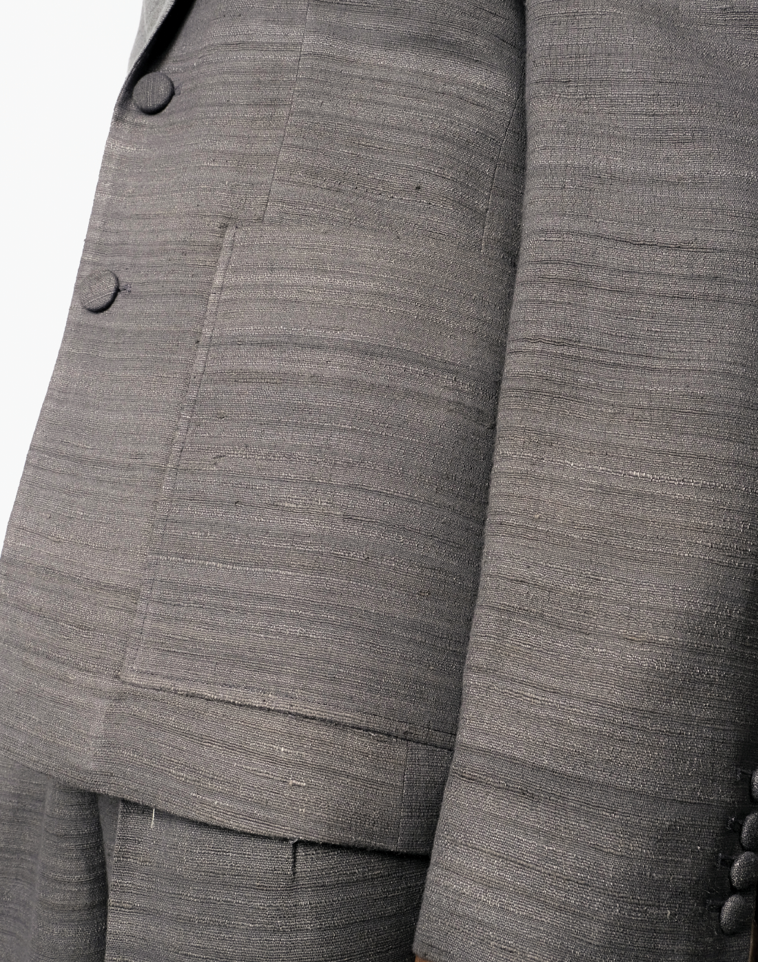 Grey handloom matka silk single-breasted blazer with notch lapels and patch pockets by Taarini Anand pocket