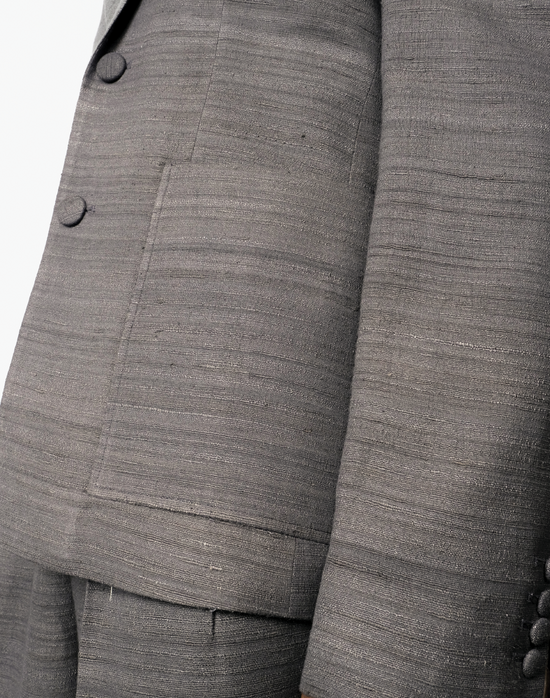 Grey handloom matka silk single-breasted blazer with notch lapels and patch pockets by Taarini Anand pocket