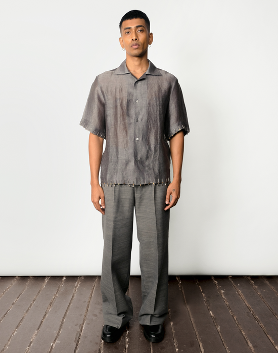 Grey silk-linen half-sleeved shirt with two-tone brass bead embroidery on hems by Taarini Anand