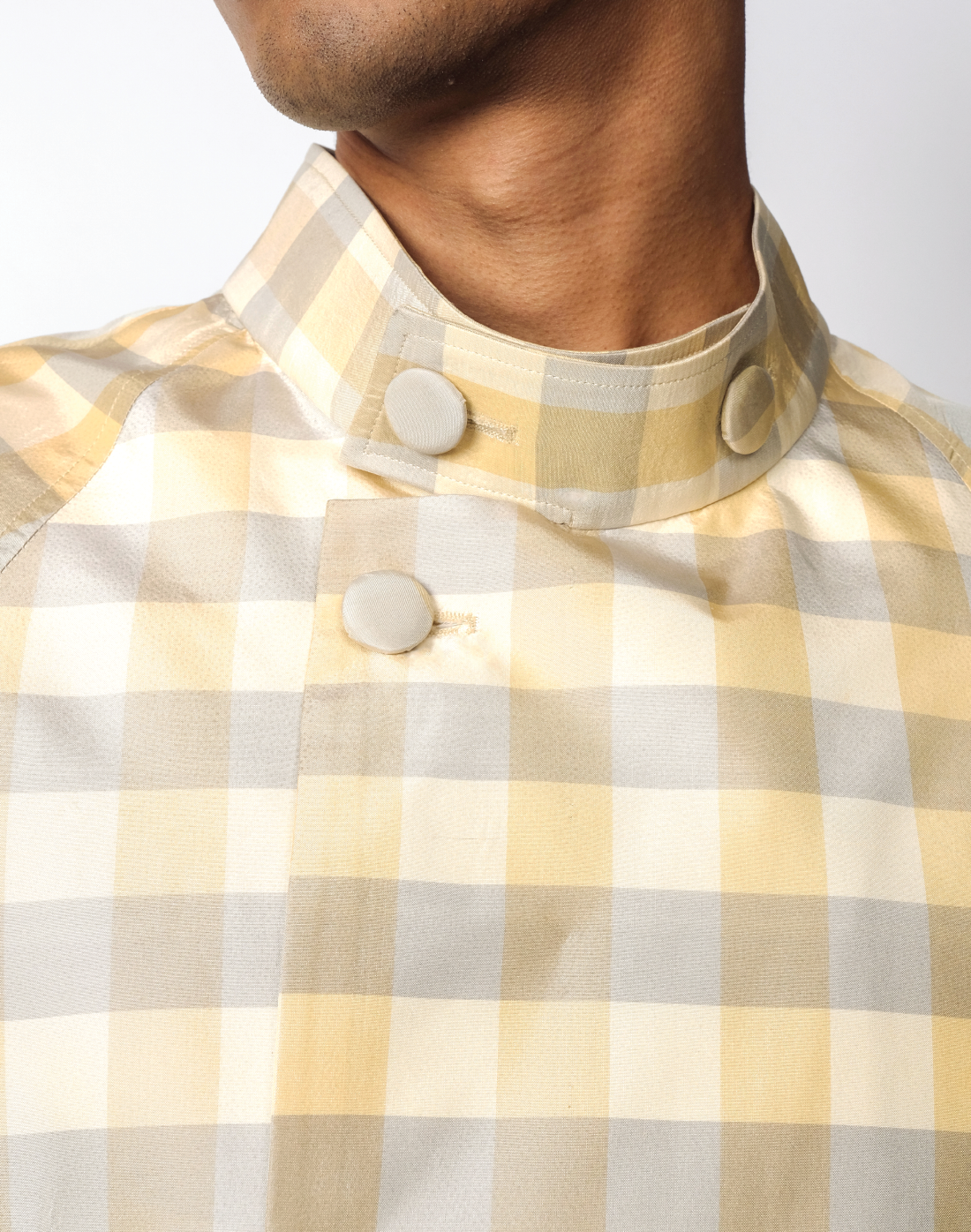 Macro gingham silk taffeta jacket in green and yellow with raglan cut and cropped silhouette by Taarini Anand close up
