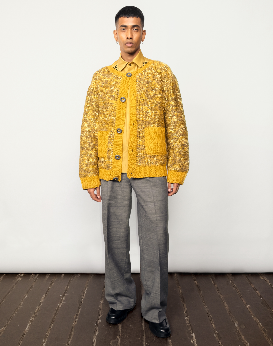 Taarini Anand hand-knit maize cardigan in yellow melange with ceramic buttons.