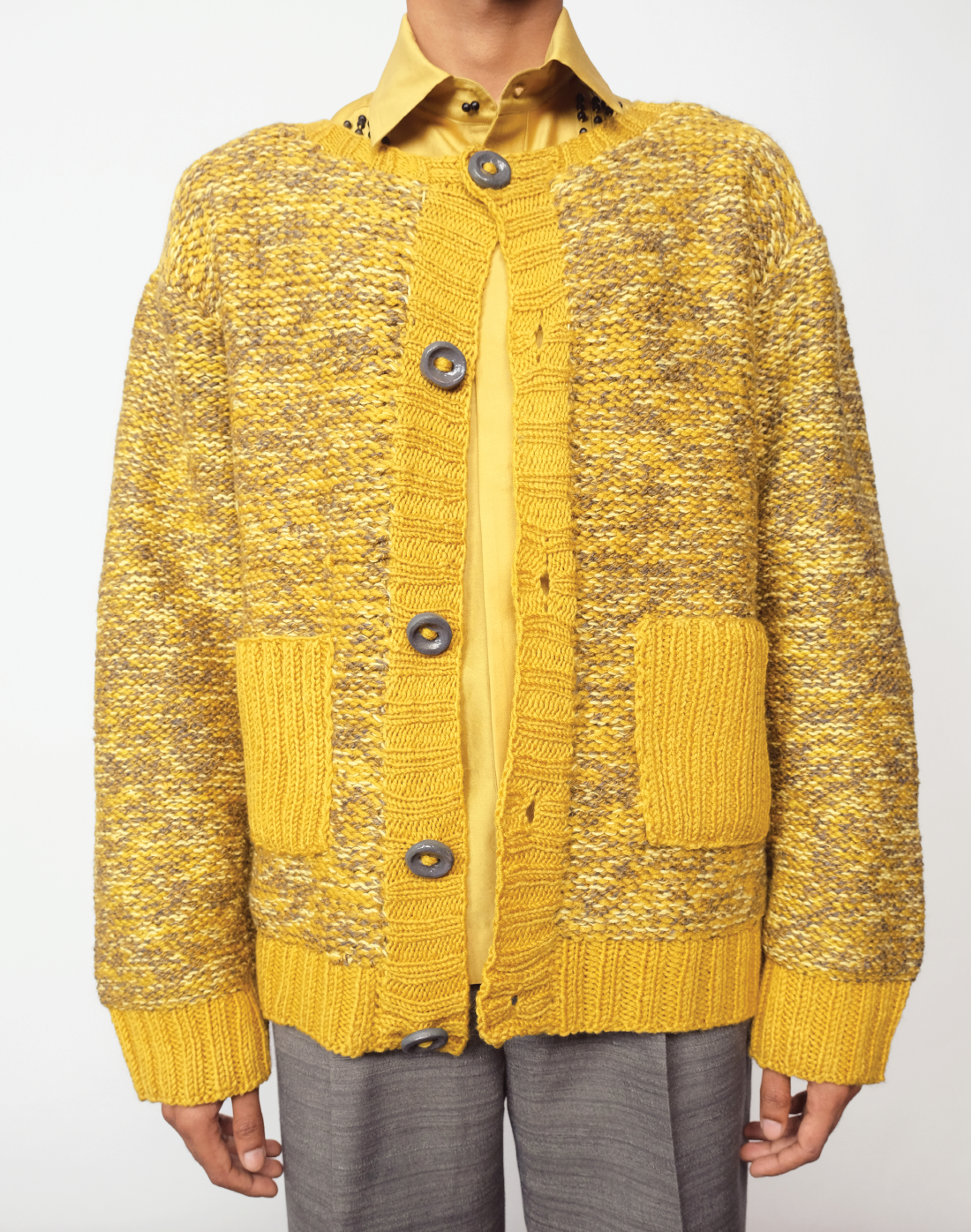 Taarini Anand hand-knit maize cardigan in yellow melange with ceramic buttons.