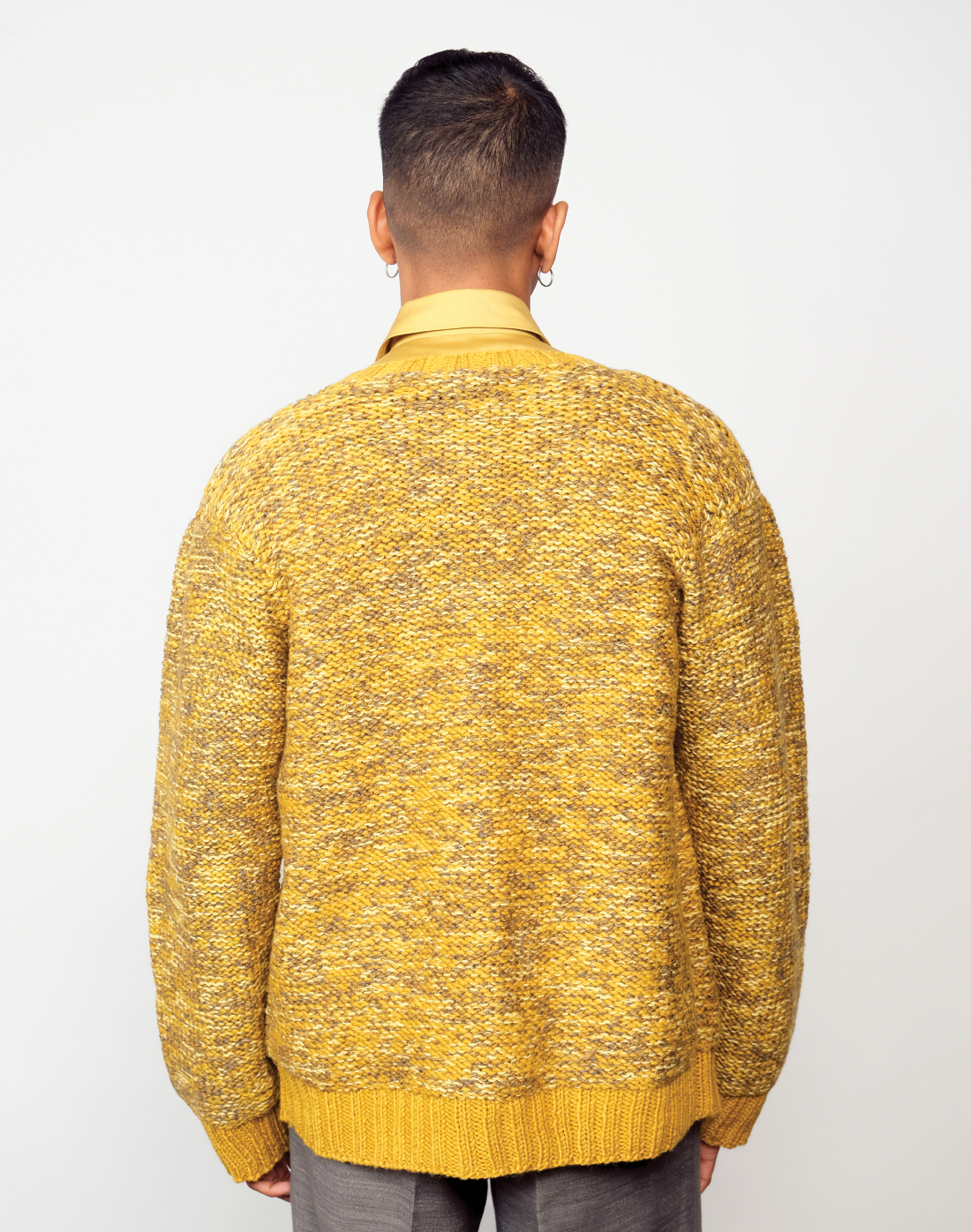 Taarini Anand hand-knit maize cardigan in yellow melange with ceramic buttons.