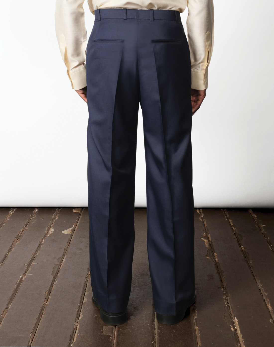 High-rise pleated cotton wide-leg trousers in navy by Taarini Anand