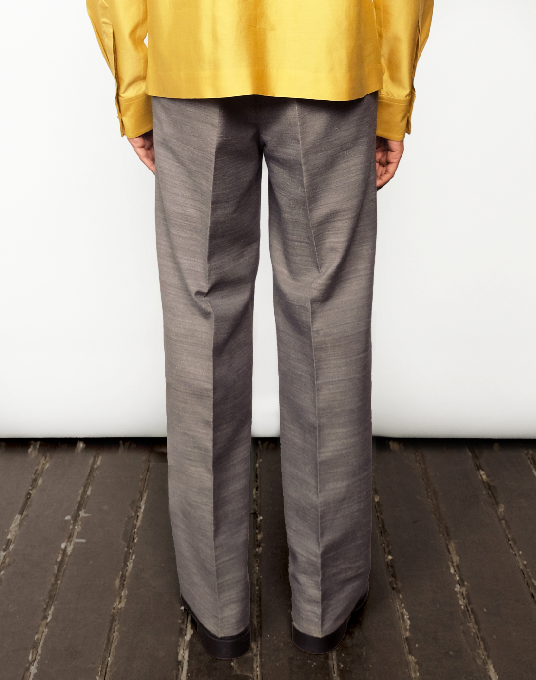 back view Taarini Anand Nocturne grey handloom silk trousers with pleated wide-leg silhouette and tailored finish