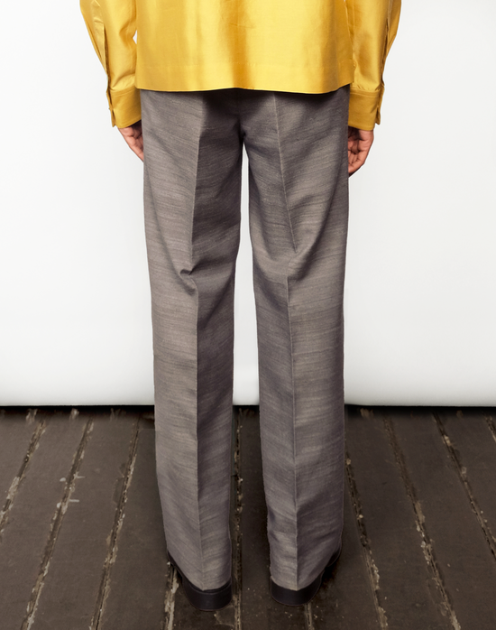 back view Taarini Anand Nocturne grey handloom silk trousers with pleated wide-leg silhouette and tailored finish