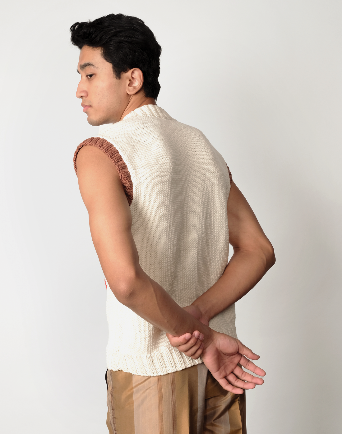 Intarsia Prism Logo Sweater Vest by Taarini Anand, cream knit with ombré triple-logo pattern