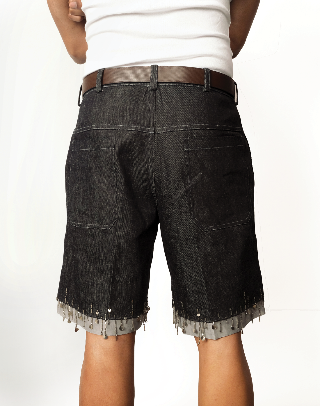 back view Taarini Anand singed-hem denim shorts with hand-embroidered bead tassels