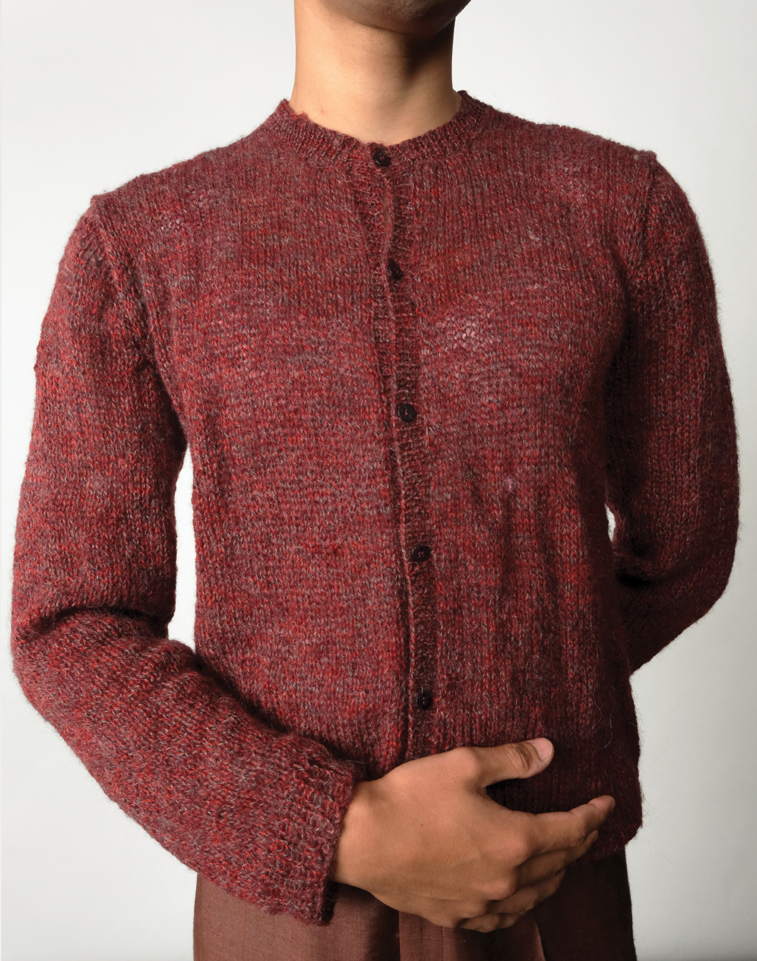 front Mulberry Cardigan by Taarini Anand, a hand-knitted cropped cardigan in maroon-grey melange mohair wool blend.