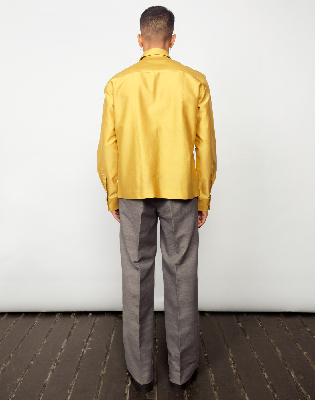 Taarini Anand Dilli Silk Shirt in mustard handloom silk with pintucks, kantha stitches and black glass bead embroidery